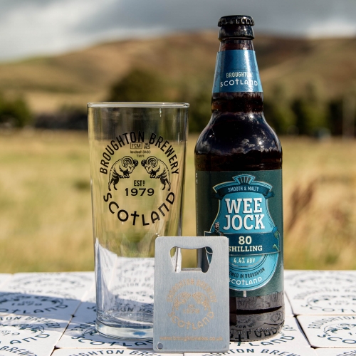 Wee Jock 80 shilling(/-) ale is a classic take on traditional scottish beers. Pictured with a glass an metal bottle opener